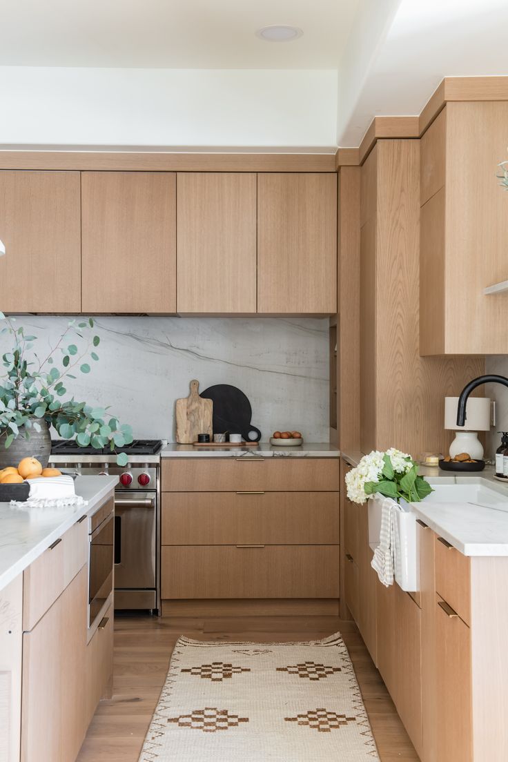 Condo development kitchen with oak cabinets and stone countertop